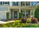 Charming front porch with a seating area, manicured landscaping, and a welcoming entrance at 2002 Thurston Dr, Indian Trail, NC 28079