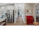 Hallway with hardwood flooring and modern fixtures leading to entrance at 2002 Thurston Dr, Indian Trail, NC 28079
