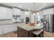 Kitchen with granite counters, stainless appliances, and a central island with seating at 2002 Thurston Dr, Indian Trail, NC 28079