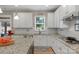Kitchen with white cabinets, granite countertops, stainless steel appliances and window at 2002 Thurston Dr, Indian Trail, NC 28079