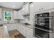 Kitchen with white cabinets, stainless appliances, and granite counters at 2002 Thurston Dr, Indian Trail, NC 28079
