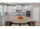 Kitchen with granite countertops, stainless steel appliances, and custom cabinetry at 2002 Thurston Dr, Indian Trail, NC 28079