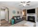 Cozy living room showcasing a fireplace with a wooden accent wall and decorative wall art at 2002 Thurston Dr, Indian Trail, NC 28079