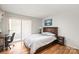 Spacious bedroom with hardwood floors, a large window, and a comfortable queen-sized bed at 212 W 10Th St # 17, Charlotte, NC 28202
