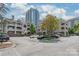 Condo building exterior with large windows and parking spaces, showcasing city living at 212 W 10Th St # 17, Charlotte, NC 28202