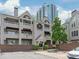 Attractive multi-story condominium building with balconies, brick accents, and manicured landscaping near downtown at 212 W 10Th St # 17, Charlotte, NC 28202