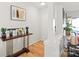 Hallway features a decorative table with plants and artwork, and wood flooring at 212 W 10Th St # 17, Charlotte, NC 28202
