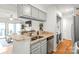 Bright kitchen featuring granite countertops, stainless steel appliances, and a convenient breakfast bar at 212 W 10Th St # 17, Charlotte, NC 28202