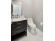 Bathroom features a vanity with dark cabinets, a light countertop, a designer faucet and a modern toilet at 221 Sycamore Creek Rd, Fort Mill, SC 29708