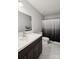 Bathroom featuring marble floors, modern sink, and gray and white shower curtain at 221 Sycamore Creek Rd, Fort Mill, SC 29708