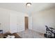 Neutral bedroom featuring plush carpet, two doors, ceiling light and an electric drum set at 221 Sycamore Creek Rd, Fort Mill, SC 29708