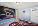 A comfy bedroom with an accent wall, a door to the hall and grey carpet at 221 Sycamore Creek Rd, Fort Mill, SC 29708