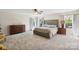 Spacious bedroom features plush carpeting, a ceiling fan, and large windows for natural light at 221 Sycamore Creek Rd, Fort Mill, SC 29708