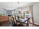Dining area shows a long table with seating, views to the pool and access to the living room area at 221 Sycamore Creek Rd, Fort Mill, SC 29708