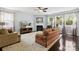 Inviting living room with a fireplace, hardwood floors, large windows, and plenty of comfortable seating at 221 Sycamore Creek Rd, Fort Mill, SC 29708
