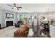 Spacious living room features a fireplace, hardwood floors, large windows, and an adjacent dining area at 221 Sycamore Creek Rd, Fort Mill, SC 29708
