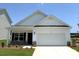 Charming single-story home boasts a two-car garage, stone accents, and manicured lawn at 2219 Catawba Trace Dr, Catawba, NC 28609