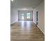 Spacious living room featuring wood-look floors, neutral paint, and abundant natural light at 2219 Catawba Trace Dr, Catawba, NC 28609