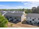 Aerial view of homes showcasing roof lines, driveways, and community landscaping at 2340 Belterra Dr, Charlotte, NC 28216