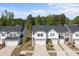 An aerial view shows the homes, landscaping, and tree lined perimeter of the real estate community at 2340 Belterra Dr, Charlotte, NC 28216
