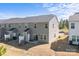 A drone shot shows the backyard and exterior features of the home, including a patio with seating at 2340 Belterra Dr, Charlotte, NC 28216