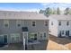 Backyard view of home with patio and outdoor seating, siding, and roof lines with landscaping at 2340 Belterra Dr, Charlotte, NC 28216