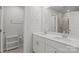 Bright bathroom features a double sink vanity with quartz counters and a shower with glass door at 2340 Belterra Dr, Charlotte, NC 28216