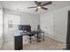 Cozy bedroom featuring a ceiling fan, and a modern desk setup at 2340 Belterra Dr, Charlotte, NC 28216