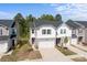 Exterior view of homes showcasing the siding, roof lines, garages, driveways, and landscaping at 2340 Belterra Dr, Charlotte, NC 28216