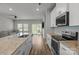 Modern kitchen with granite countertops, stainless steel appliances and access to living room at 2340 Belterra Dr, Charlotte, NC 28216