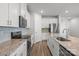Bright kitchen featuring stainless appliances, granite countertops, and tile backsplash at 2340 Belterra Dr, Charlotte, NC 28216