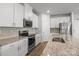 Beautiful kitchen with stainless steel appliances, granite countertops, and white cabinets at 2340 Belterra Dr, Charlotte, NC 28216