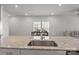 Kitchen island featuring granite countertops with stainless steel sink and modern faucet at 2340 Belterra Dr, Charlotte, NC 28216