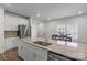 Spacious kitchen featuring a large island, stainless steel appliances, and white cabinets at 2340 Belterra Dr, Charlotte, NC 28216