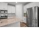 Open kitchen with granite countertops, stainless steel appliances, and hardwood floors at 2340 Belterra Dr, Charlotte, NC 28216