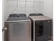 Modern laundry room features gray Samsung washer and dryer at 2340 Belterra Dr, Charlotte, NC 28216