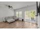 Bright and airy living room featuring hardwood floors and a sliding glass door at 2340 Belterra Dr, Charlotte, NC 28216