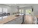 Open living space with dining area and modern kitchen featuring stainless appliances at 2340 Belterra Dr, Charlotte, NC 28216