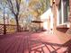 This beautiful back deck has a table and umbrella, perfect for entertaining guests at 237 Walnut Point Dr, Matthews, NC 28105
