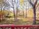 The large, private backyard features mature trees, providing a serene and peaceful setting at 237 Walnut Point Dr, Matthews, NC 28105