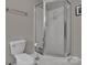 Clean bathroom featuring a toilet, shower, light gray walls, and white trim at 237 Walnut Point Dr, Matthews, NC 28105