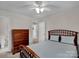 Bedroom featuring a bed, dresser, and an ensuite bathroom at 237 Walnut Point Dr, Matthews, NC 28105