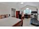 This bedroom features a vaulted ceiling, desk area, and a treadmill for exercise at 237 Walnut Point Dr, Matthews, NC 28105
