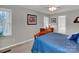 Comfortable bedroom with two windows, carpeted floors, and neutral colored walls at 237 Walnut Point Dr, Matthews, NC 28105