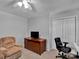 Comfortable bedroom featuring carpeted floors, neutral colored walls, and a tv at 237 Walnut Point Dr, Matthews, NC 28105