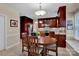 Open dining area situated next to updated kitchen with stainless steel refrigerator at 237 Walnut Point Dr, Matthews, NC 28105