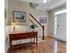 Well-lit foyer with hardwood floors, a staircase, and natural light through the front door at 237 Walnut Point Dr, Matthews, NC 28105