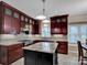 Modern kitchen featuring granite countertops, stainless steel appliances, and dark cabinets at 237 Walnut Point Dr, Matthews, NC 28105