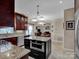 Bright kitchen features granite countertops, stainless steel appliances, and a central island at 237 Walnut Point Dr, Matthews, NC 28105