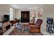 Comfortable living room featuring a large window, a desk, and a recliner chair at 237 Walnut Point Dr, Matthews, NC 28105